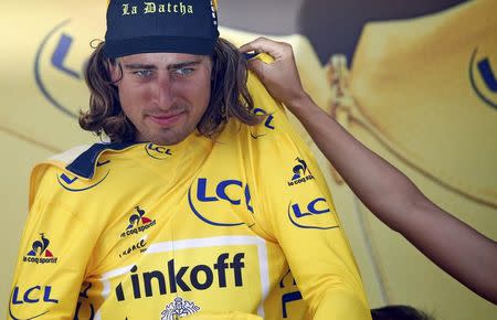 Cycling - Tour de France cycling race - The 237.5 km (147.5 miles) Stage 4 from Saumur to Limoges, France - 05/07/2016 - Yellow jersey leader Tinkoff rider Peter Sagan of Slovakia reacts on the podium. REUTERS/Juan Medina