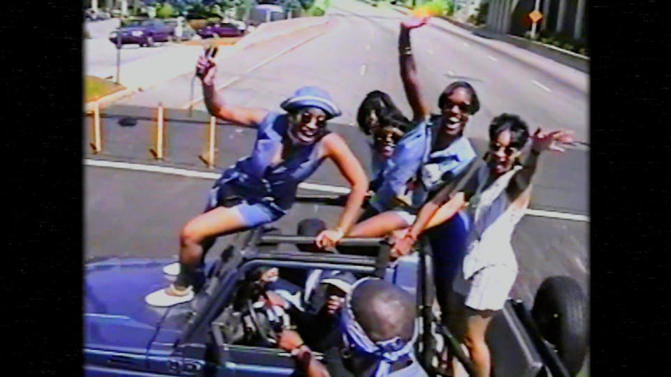 Party goers standing on a Jeep in celebration in Freaknik: The Wildest Party Never Told.