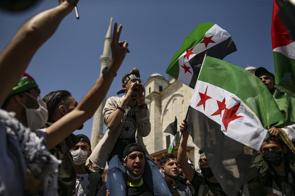 Protesters chant anti-Israel slogans during a rally outside Fatih mosque in Istanbul following Friday prayers, Friday, May 4, 2021, in support of Palestinians, killed in the recent escalation of violence in Jerusalem and the Gaza Strip. People in Turkey have been demonstrating against Israel this week and have gathered without much interference from the police despite a strict lockdown to curb COVID-19 infections that have ordered people to stay home until May 17.(AP Photo/Emrah Gurel)