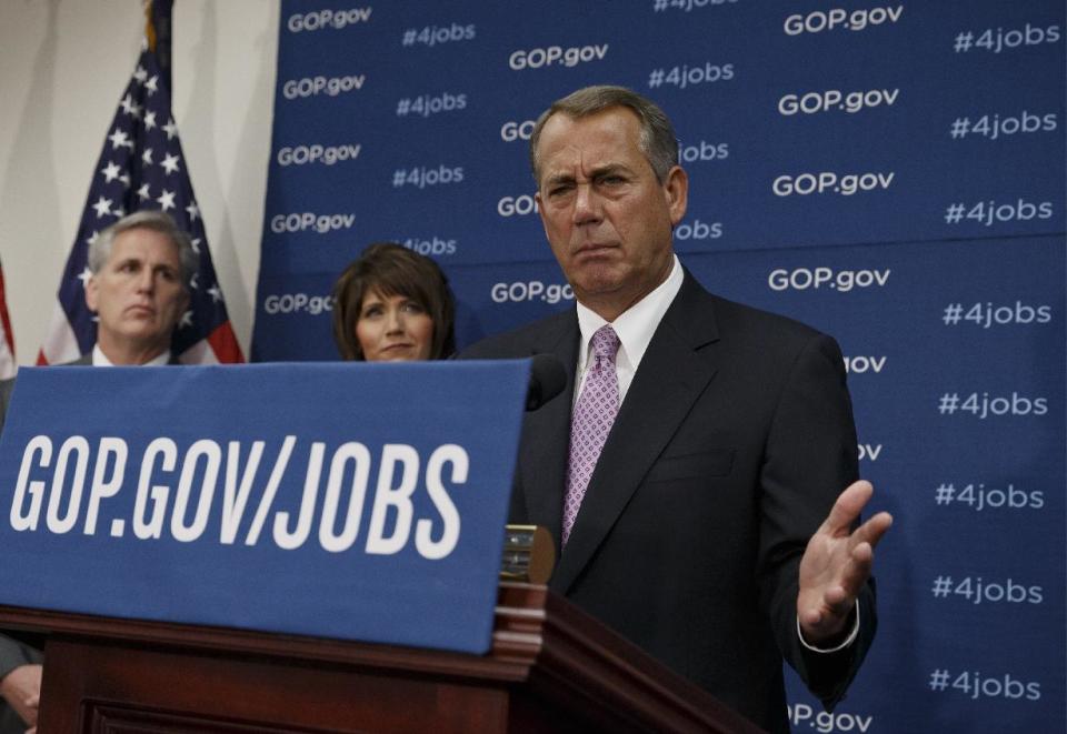 House Speaker John Boehner of Ohio, and GOP leaders face reporters on Capitol Hill in Washington, Tuesday, Jan. 14, 2014, following a weekly House Republican Conference meeting. Behind Boehner are, from left, House Majority Whip Kevin McCarthy of Calif., and Rep. Kristi Noem, R-S.D. The Republicans tied the recent stagnant employment reports to the policies of President Barack Obama and Democratic lawmakers. (AP Photo/J. Scott Applewhite)