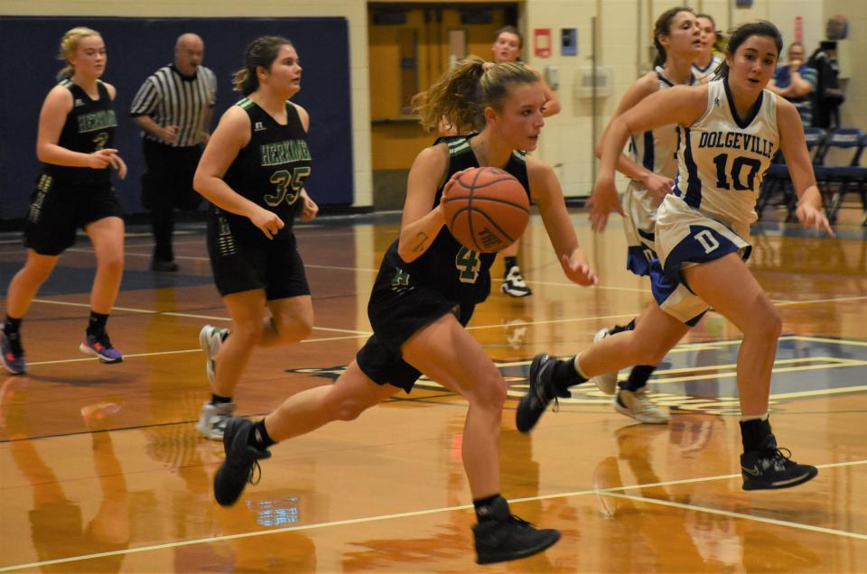 Herkimer Magician Charity Dygert (left) advances the ball up the court Dec. 13, 2022, with Alexandria Comstock (10) defending for the Dolgeville Blue Devils. The Center State Conference Division II co-champions will meet for the third time this season Tuesday in the Section III quarterfinals.