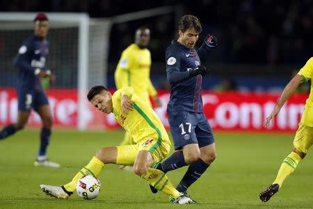 Football Soccer - Paris St Germain v Nantes French Ligue 1 - Parc des Princes, Paris, France - 19/11/16. Paris St Germain's Maxwell challenges Nantes' Mariusz Stepinski (L). REUTERS/Gonzalo Fuentes