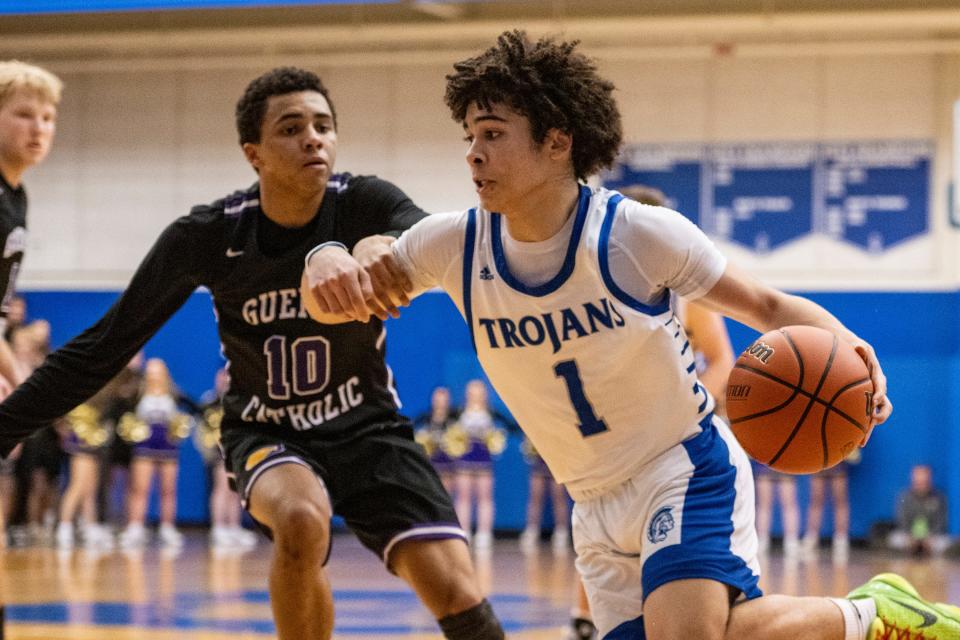 Indianapolis Bishop Chatard freshman Ethan Roseman (1) drives the ball along the baseline while being defended by Guerin Catholic High School senior Kamea Chandler (10) during the second half of an IHSAA Sectional Basketball championship game, Monday, March 6, 2023, at Indianapolis Shortridge High School. Guerin Catholic won 53-41.