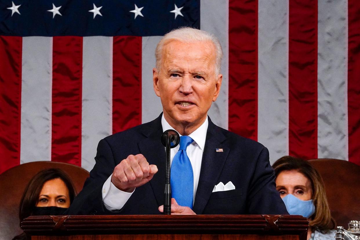 <p>US President Joe Biden, flanked by US Vice President Kamala Harris (L) and Speaker of the House of Representatives Nancy Pelosi (R), addresses a joint session of Congress at the US Capitol in Washington, DC, on April 28, 2021.</p> (Photo by MELINA MARA/POOL/AFP via Getty Images)