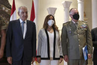 Lebanese Parliament Speaker Nabih Berri, left, the Head of Mission and Force Commander of the United Nations Interim Force in Lebanon (UNIFIL), Major-General Stefano Del Col from Italy, right, and Lebanese outgoing Defense Minister Zeina Akar, center, pose for a picture during a news conference, in Beirut, Lebanon, Thursday, Oct. 1, 2020. Berri announced Thursday that an agreement has been reached on a framework of indirect talks between Lebanon and Israel over the longstanding disputed maritime border between the two countries. (AP Photo / Bilal Hussein)