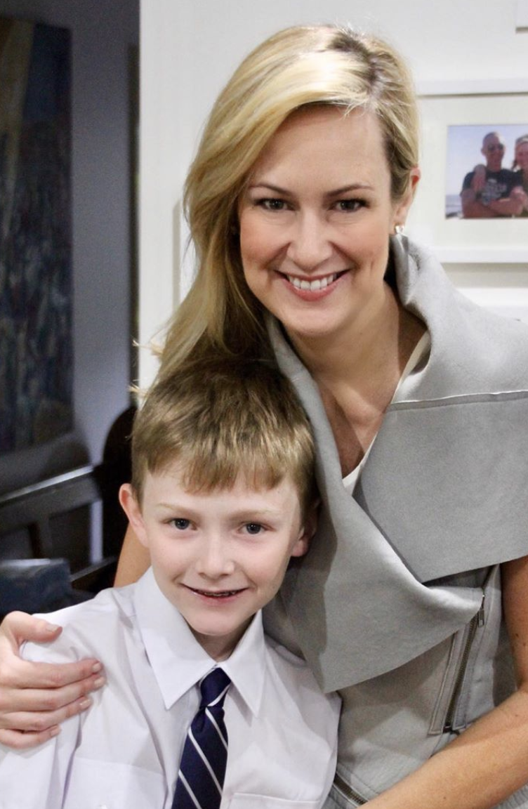 A photo of Melissa Doyle and her young son Nick wearing a school uniform.