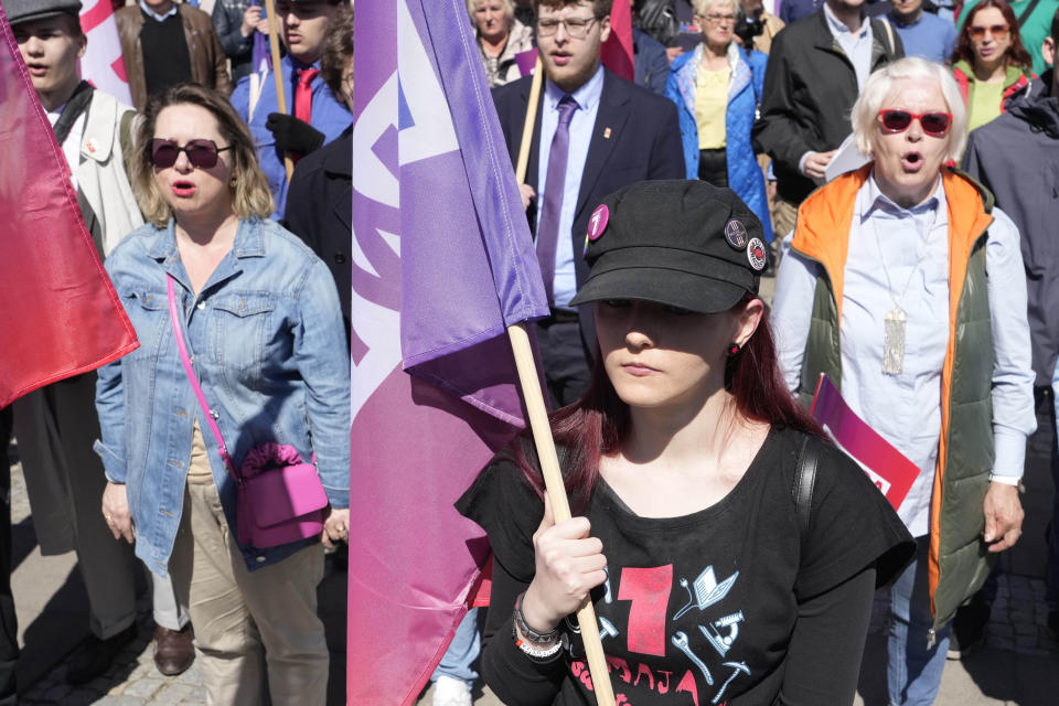 Members of left-wing parties and trade unions march in traditional May Day parade, one of the smallest ever, to mark Labour Day, in Warsaw, Poland, Monday, May 1, 2023.The small attendance could be due to a long weekend in Poland and nice weather that encouraged many people to leave cities on brief vacation. (AP Photo/Czarek Sokolowski)