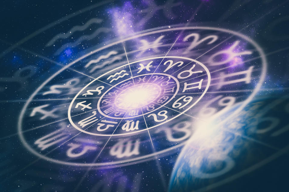 Astrological zodiac signs inside of horoscope circle on universe background - astrology and horoscopes concept