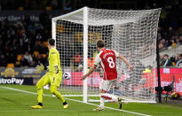 Arsenal's Martin Odegaard scores their side's second during the English Premier League soccer match between Wolverhampton Wanderers and Arsenal at the Molineux Stadium in Wolverhampton, England, Saturday, April 20, 2024. (Nick Potts/PA via AP)