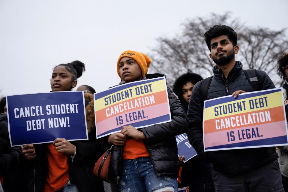 People rally in support of the Biden administration's student debt relief plan in front of the the U.S. Supreme Court on February 28, 2023 in Washington, DC.