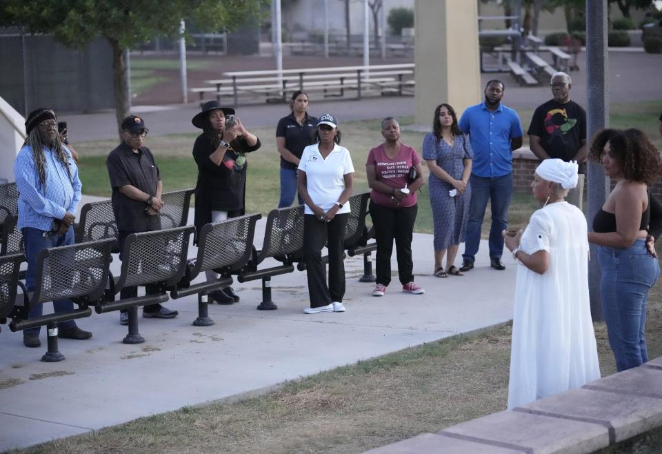 People gather at a remembrance for Buffalo shooting victims at Eastlake Park in Phoenix on May 18, 2022.