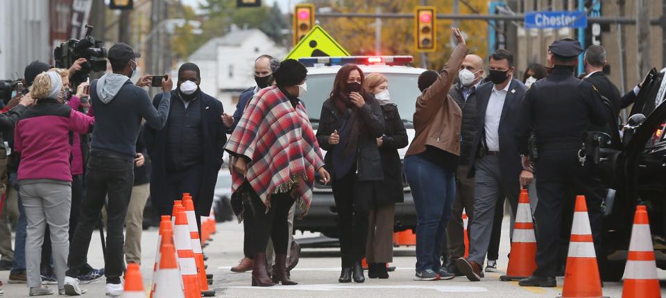 Democratic vice presidential candidate Sen. Kamala Harris, D-Calif., center visits outside of the Cuyahoga County Board of Elections  during  campaign visit on Saturday, Oct. 24, 2020 in Cleveland.  [Mike Cardew/Beacon Journal]