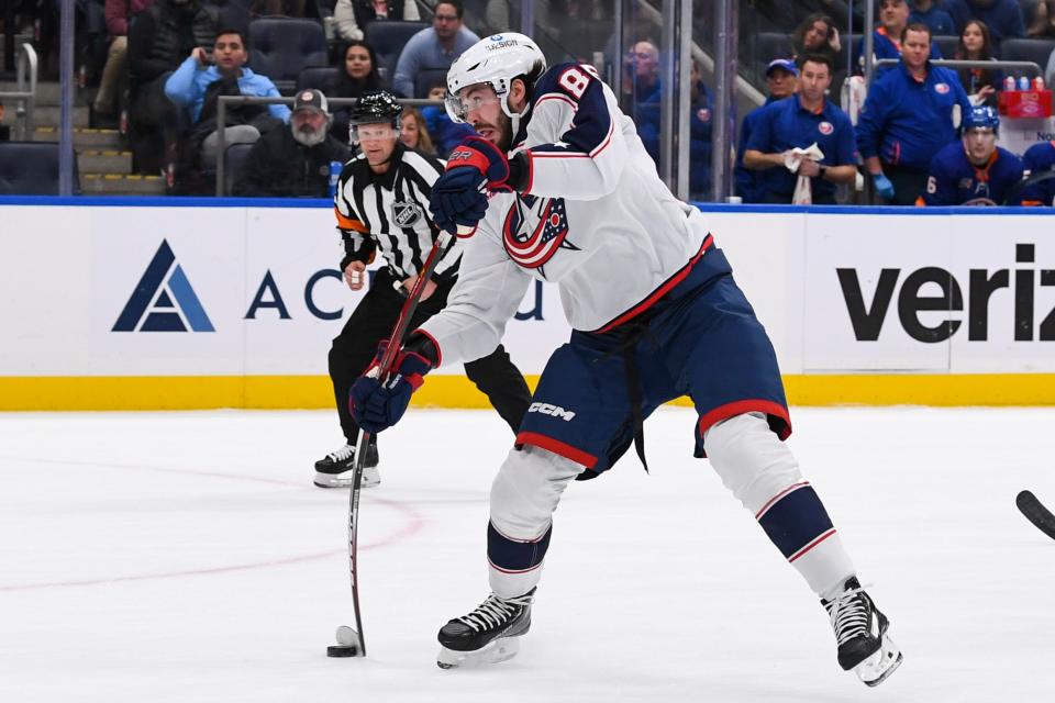 Dec 29, 2022; Elmont, New York, USA; Columbus Blue Jackets right wing Kirill Marchenko (86) attempts a shot against the New York Islanders during the first period at UBS Arena. Mandatory Credit: Dennis Schneidler-USA TODAY Sports