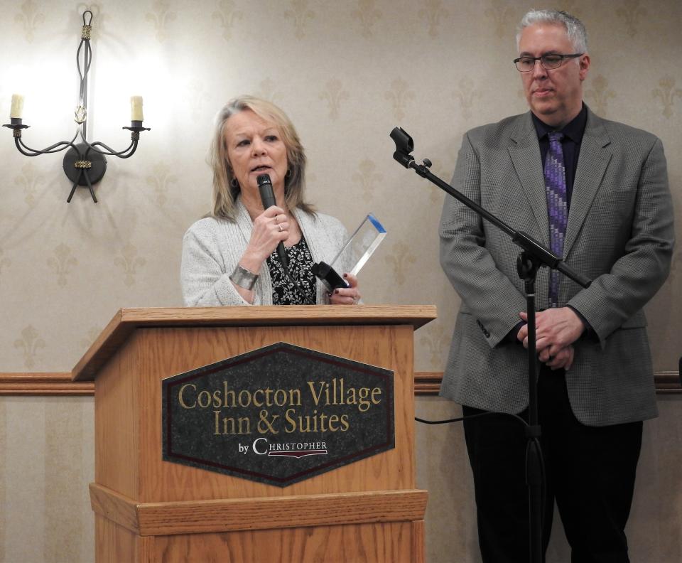 Vickey Casey, Executive Director of First Step Family Violence Intervention, with Steve Oster, Superintendent of the Coshocton County Board of DD, speak Wednesday at the annual Developmental Disability Awareness Month Luncheon at Coshocton Village Inn and Suites. First Step was recognized for employee an individual with a disability in their clothing room.