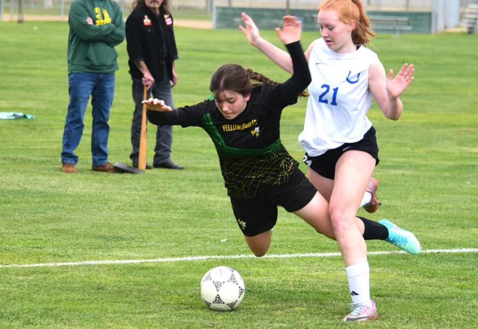 Hilmar High midfielder Brisa Gonzales (9) draws a foul from University of Prep’s Raegan Salado in the first half of the Northern California Regional Division V semifinal match on Thursday, Feb. 29, 2024 at Hilmar High School.