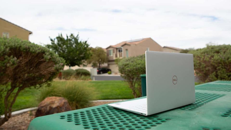 dell xps 13 laptop on a park table