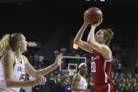 Texas Tech forward Brittany Brewer, right, scores over Baylor forward Lauren Cox, left, in the first half of an NCAA college basketball game, Saturday, Jan. 25, 2020, in Waco Texas. (AP Photo/Rod Aydelotte)