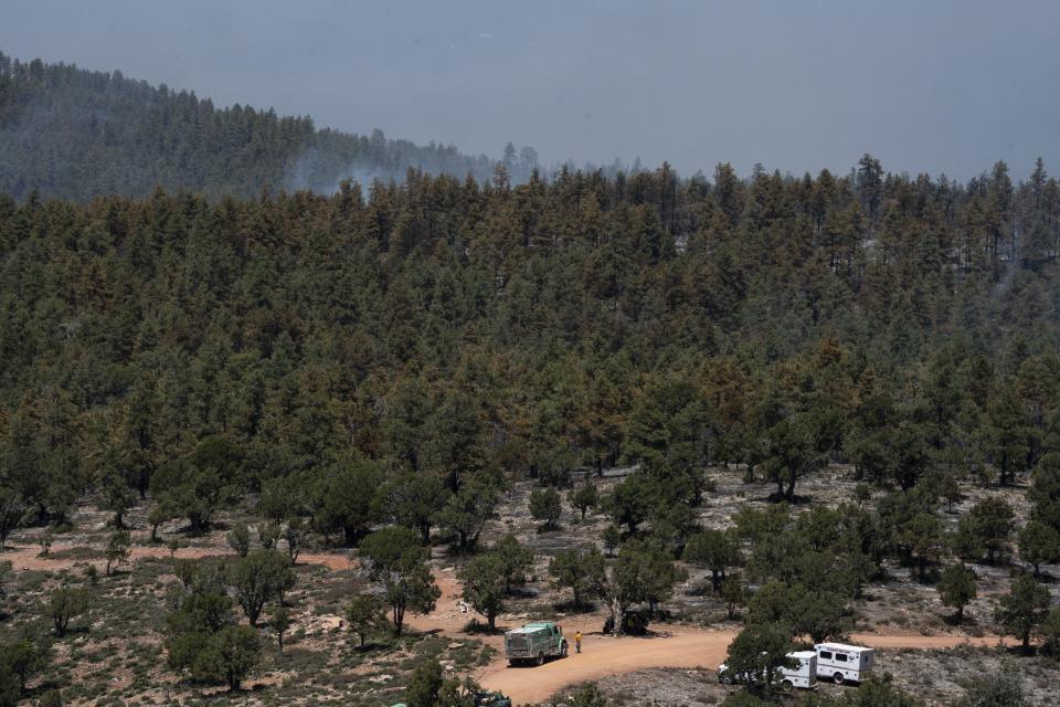 Firefighters monitor the Diamond Point/Pyeatt Draw prescribed fire, April 22, 2024, northeast of Payson, Arizona.