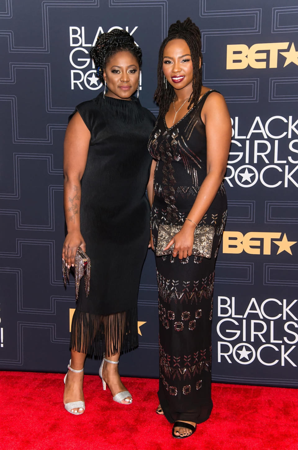 Activists Alicia Garza and Opal Tometi, founders of the #BlackLivesMatter movement, in coordinating Twenties-inspired dresses  