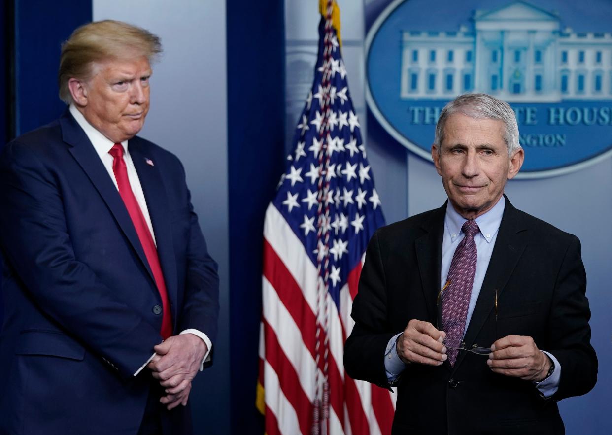  Dr Fauci (R), director of the National Institute of Allergy and Infectious Diseases, and President Trump participate in the daily coronavirus task force briefing at the White House (Getty Images)