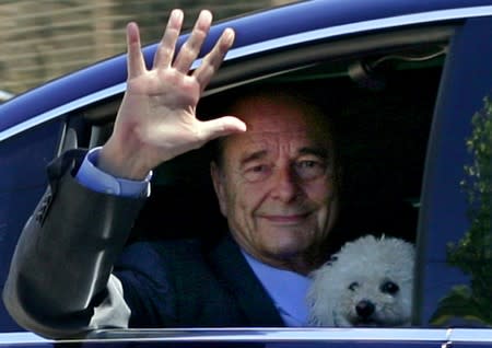 FILE PHOTO: File photo of French President Chirac waving from his car as he arrives at the presidential retreat of Bregancon near Toulon