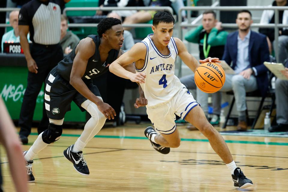 Deer CreekÕs Clyde Davis Jr. drives to the basket against Edmond Santa Fe during the McGuinness Classic boys tournament championship basketball game at Bishop McGuinness high school in Oklahoma City, Saturday, Jan. 7, 2023.