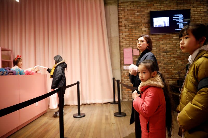 Fans of K-pop idol boy band BTS shop at a pop-up store selling BTS goods in Seoul