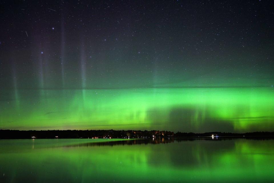 <p>Star Tribune via Getty Images</p> Northern lights are seen in the night sky near Canyon, Minn. in August of 2019. 