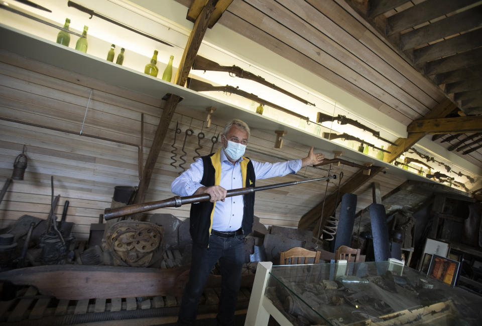 Belgian amateur archeologist Johan Vandewalle displays a practice bayonet gun used in training of World War I soldiers, at his museum at Polygon wood, in Zonnebeke, Belgium, Thursday, April 22, 2021. Born 60 years ago on the frontline of the Passchendaele Battle, Vandewalle has been steeped in the horrors of the 1914-1918 global conflict. On another Anzac Day turned lonesome by the global pandemic, solitary actions show all the more how the sacrifices of Australia and New Zealand during World War I are far from forgotten. While global attention will turn at dawn on Sunday to the beaches of Turkey’s Gallipoli where the two emerging countries crafted a sense of nationhood from the horrors of war in April 1915, all along the front line in Europe, small ceremonies will show gratitude over a century after the war ended. (AP Photo/Virginia Mayo)