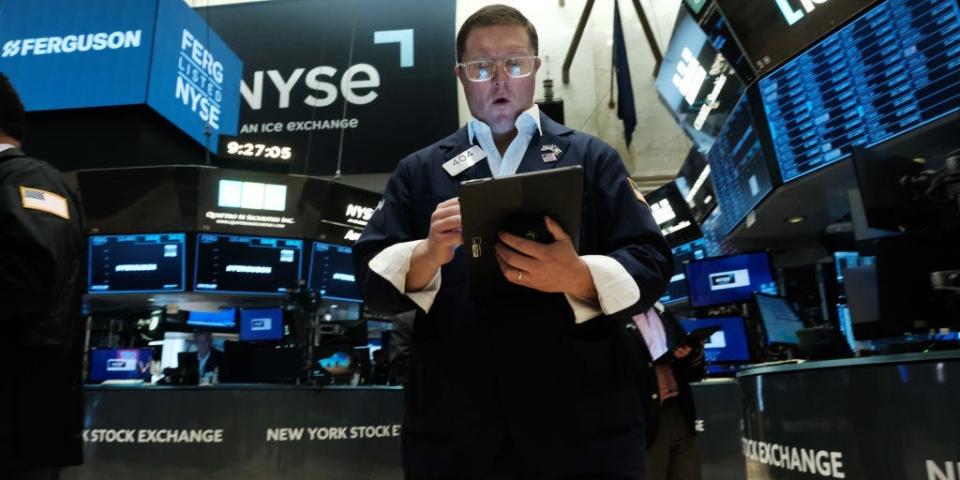 Traders work on the floor of the New York Stock Exchange (NYSE)