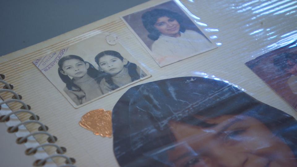 Vivanco Leiva's photo album shows a small black and white passport photo of her and her sister taken before they moved to Canada.