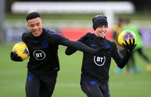 England’s Mason Greenwood (left) and Phil Foden during a training session at St George’s Park