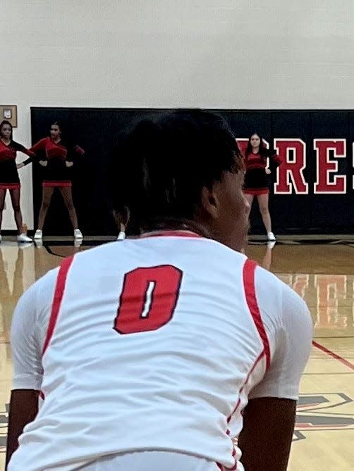 Marion Harding's Marquis Long looks to make a pass during a boys basketball home opener against Westland on Wednesday.