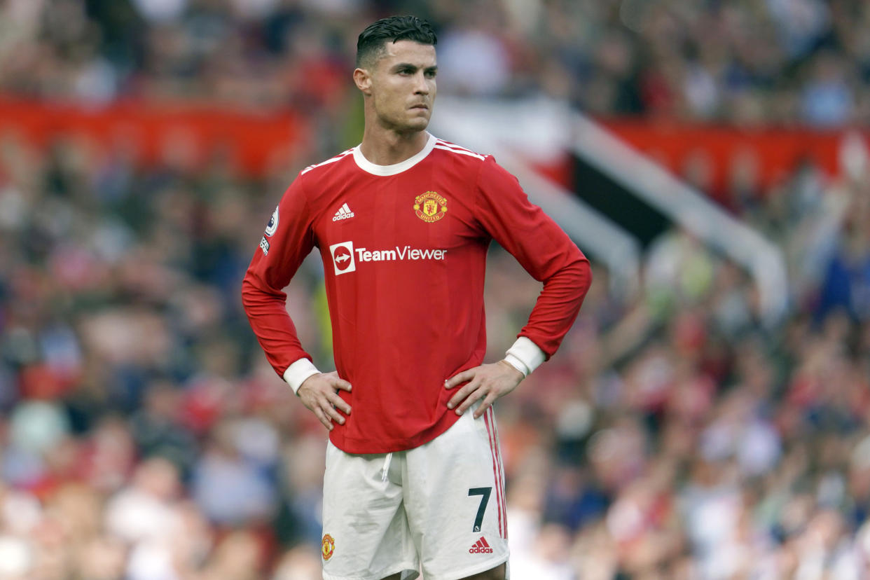 FILE- Manchester United's Cristiano Ronaldo stands on the pitch during the English Premier League soccer match between Manchester United and Norwich City at Old Trafford stadium in Manchester, England, on April 16, 2022. A Nevada woman has lost her bid in a U.S. court to force international soccer star Cristiano Ronaldo to pay millions of dollars more than the $375,000 in hush money she received after claiming he raped her in Las Vegas in 2009. (AP Photo/Jon Super, File)