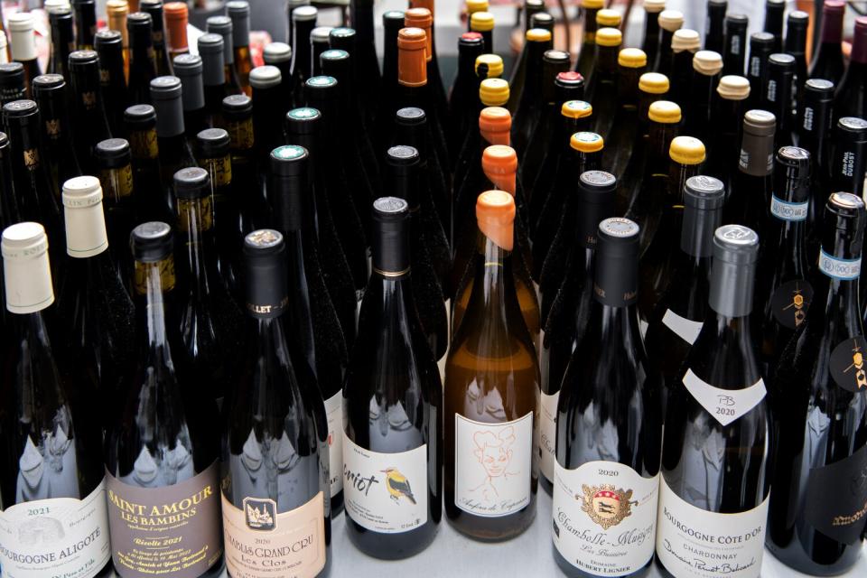 A large variety of bottles of wine on a table at Anajak Thai