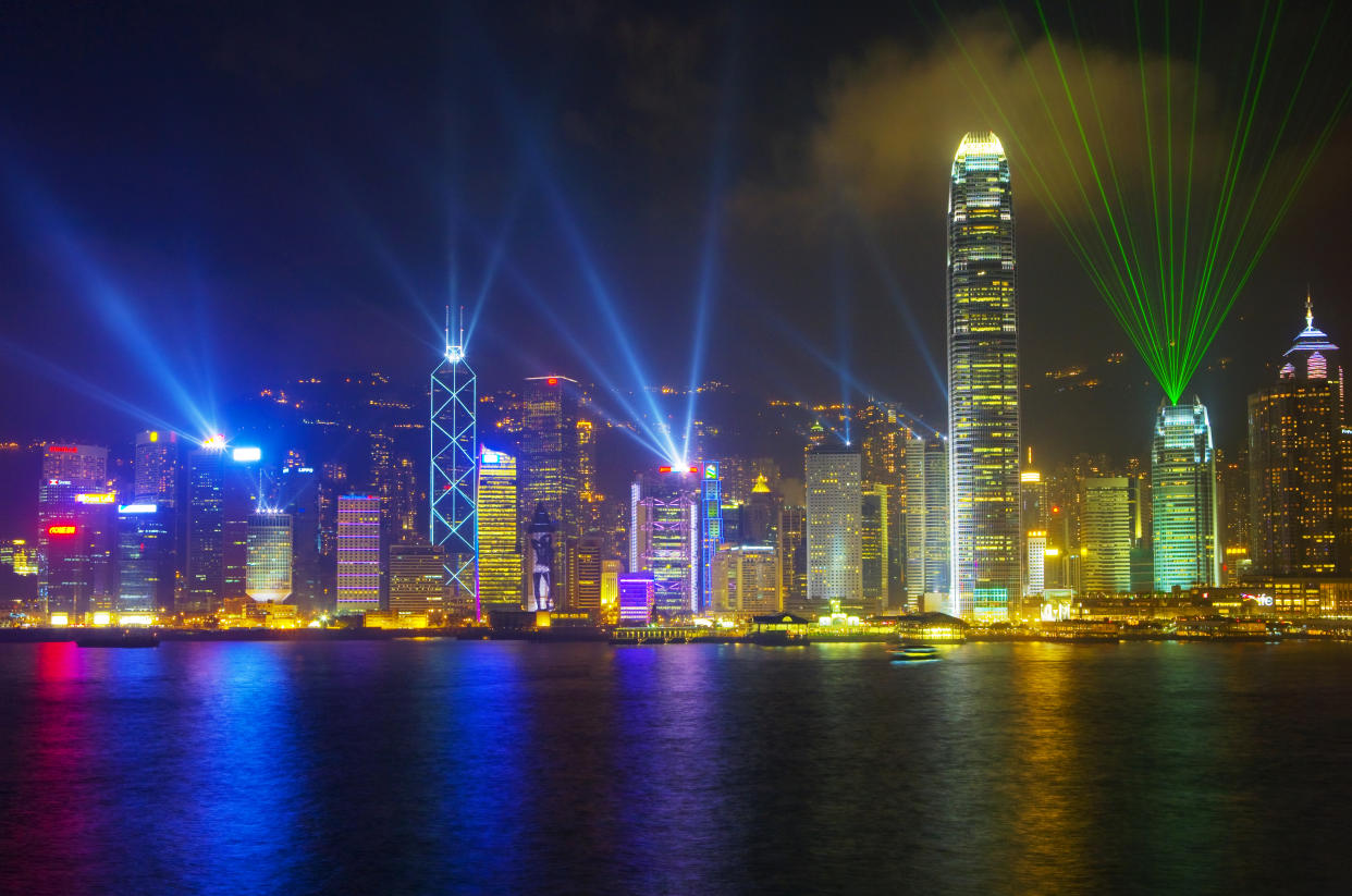 Hong Kong city skyline looking across Victoria Harbour to Hong Kong Island at night. (Photo: Getty)