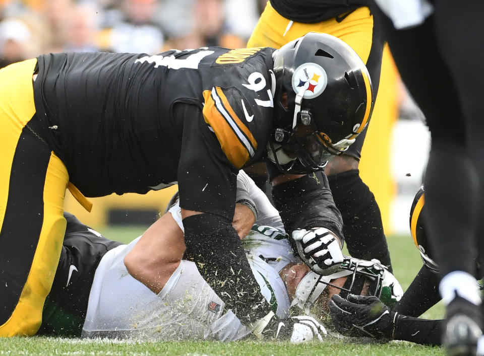 Oct 2, 2022; Pittsburgh, Pennsylvania, USA; Pittsburgh Steelers defensive tackle Cameron Heyward (97) tackles New York Jets quarterback Zach Wilson (2) at Acrisure Stadium. Mandatory Credit: Philip G. Pavely-USA TODAY Sports
