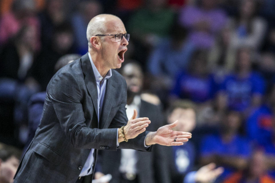 Connecticut coach Dan Hurley applauds during the first half of the team's NCAA college basketball game against Florida on Wednesday, Dec. 7, 2022, in Gainesville, Fla. (AP Photo/Alan Youngblood)