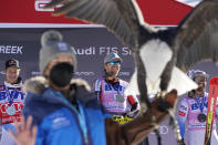 Norway's Aleksander Aamodt Kilde, center, celebrates a first place finish while posing beside second-place finisher Switzerland's Marco Odermatt, left, and third-place finisher United States' Travis Ganong after a men's World Cup super-G skiing race Friday, Dec. 3, 2021, in Beaver Creek, Colo. (AP Photo/Gregory Bull)