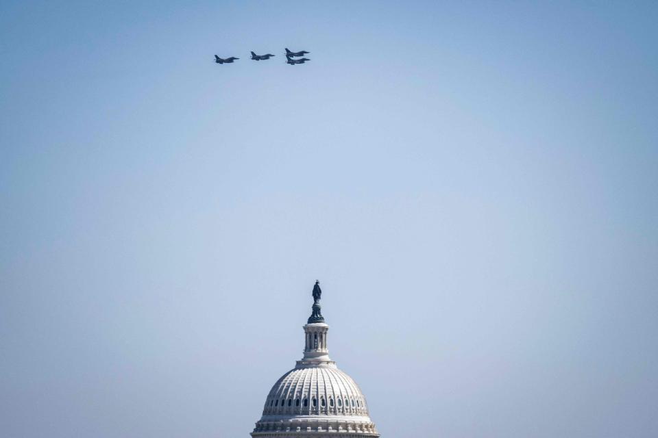 FILES) A group of F-16 aircraft are seen above the US Capitol building after a flyby over Nationals Park stadium in Washington, DC on March 30, 2023. A sonic boom that echoed over Washington Sunday June 5, 2023 was caused by fighter jets scrambling to intercept an unresponsive aircraft that later crashed in rural Virginia.
(Photo: ANDREW CABALLERO-REYNOLDS, AFP via Getty Images)