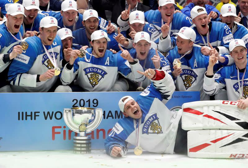 FILE PHOTO: Finland's players celebrate after winning the world championship with a 3-1 victory over Canada in the final at the Ondrej Nepela Arena in Bratislava, Slovakia.