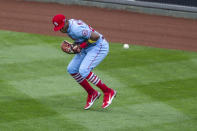 St. Louis Cardinals right fielder Justin Williams (26) misses a ball that went for a double during the third inning of a baseball game, Saturday, April 17, 2021, in Philadelphia. (AP Photo/Laurence Kesterson)