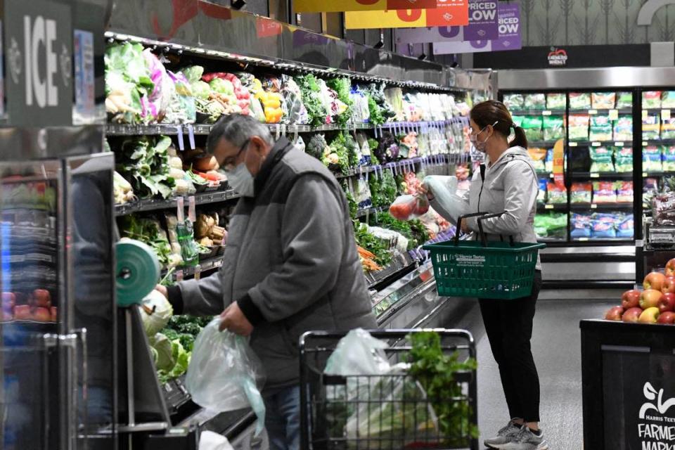 Customers in a renovated Harris Teeter in the Park Road Shopping Center. Harris Teeter&#x002019;s parent company will add nearly 700 jobs at a new fulfillment center in Concord.