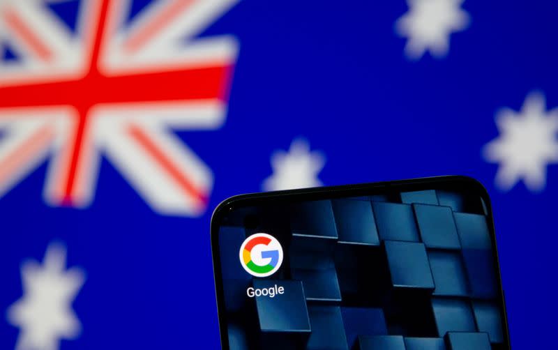 FILE PHOTO: Smartphone with google app icon is seen in front of the displayed Australian flag in this illustration taken