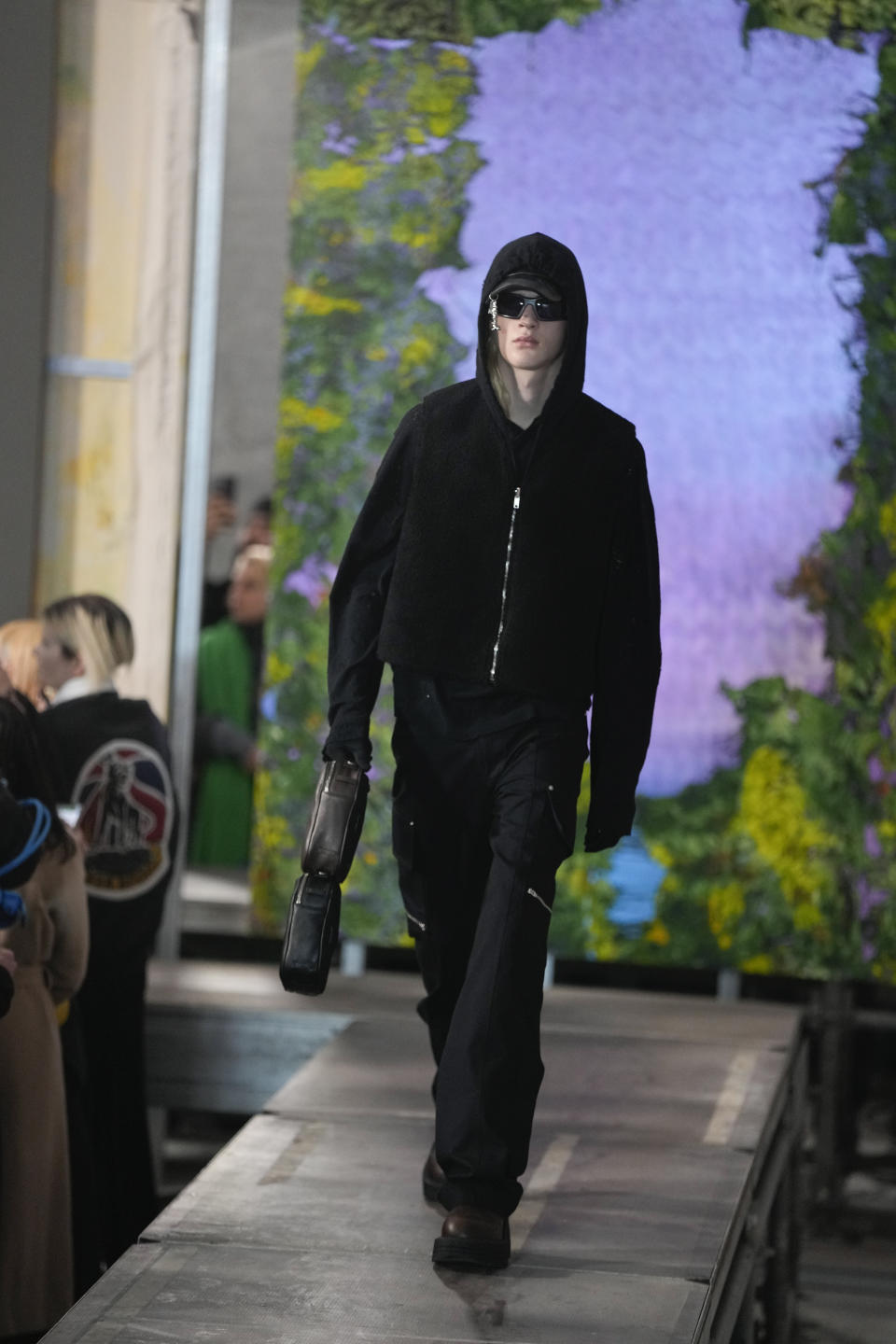 A model wears a creation as part of the ALUX9SM menswear Fall-Winter 2023-24 collection presented in Milan, Italy, Friday, Jan. 13, 2023. (AP Photo/Luca Bruno)