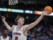 Alabama forward Grant Nelson (2) reaches for a rebound during the first half of an NCAA college basketball game against Florida at the Southeastern Conference tournament Friday, March 15, 2024, in Nashville, Tenn. (AP Photo/John Bazemore)