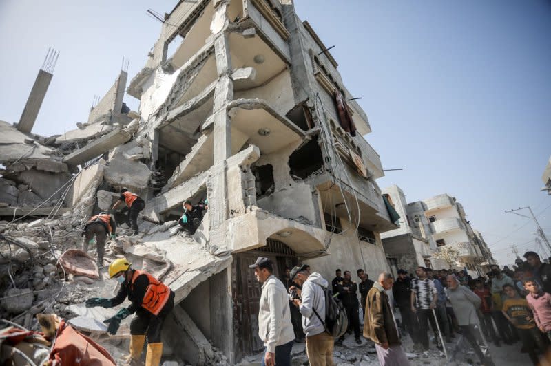 Palestinians search for victims after an Israeli airstrike on the Zorob family home in Rafah, in the southern Gaza Strip, on April 2. Photo by Ismael Mohamad/UPI