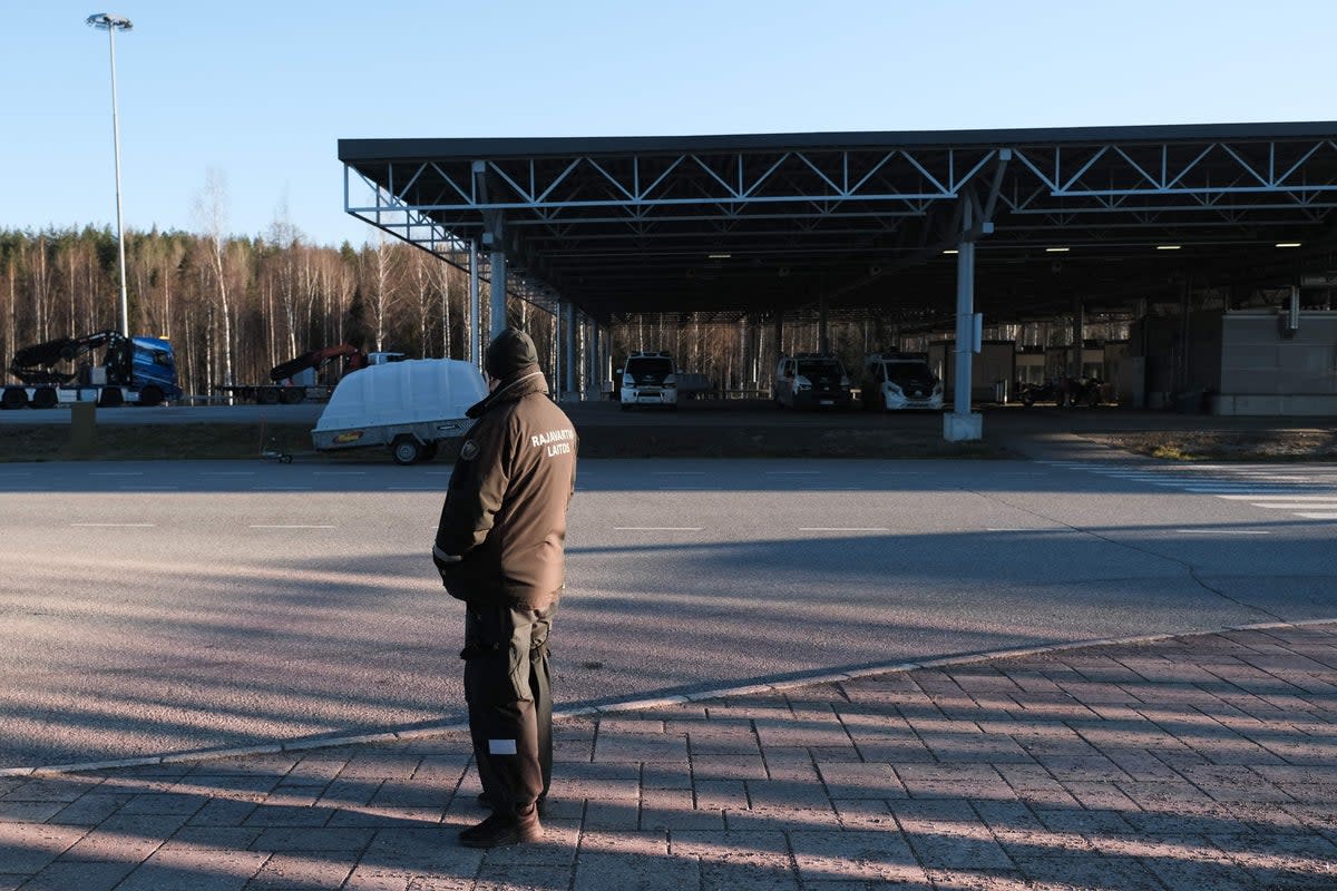 A border guard stands at the Nuijamaa border crossing station between Finland and Russia, in Lappeenranta (AFP via Getty Images)