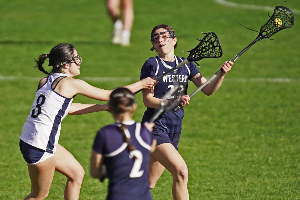 Westerly's Casey Macera, in action here earlier this month, scored six goals, including the 100th of her high school career, in the Bulldogs' 16-4 win over East Providence on Friday.