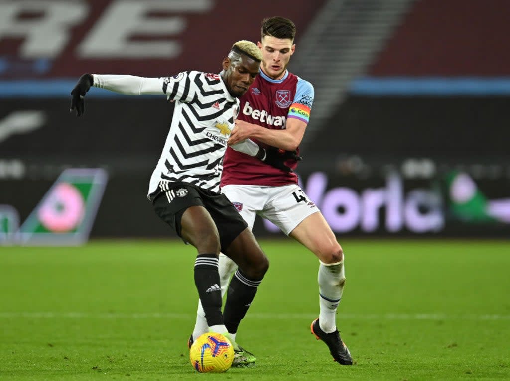 Paul Pogba and Declan Rice battle for the ball  (Getty Images)